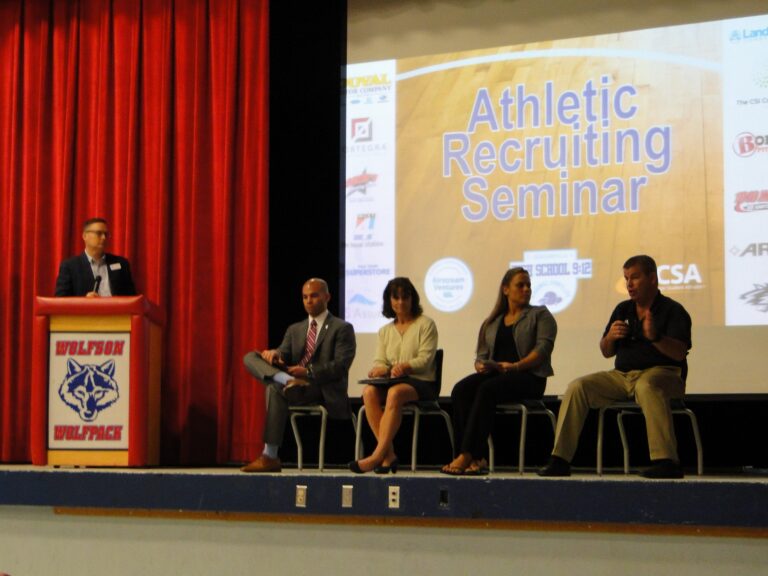 Panelists on stage at the Athletic Recruiting Seminar